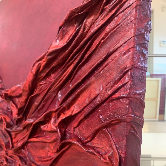 detail of the texture, different red tones, fabric artwork